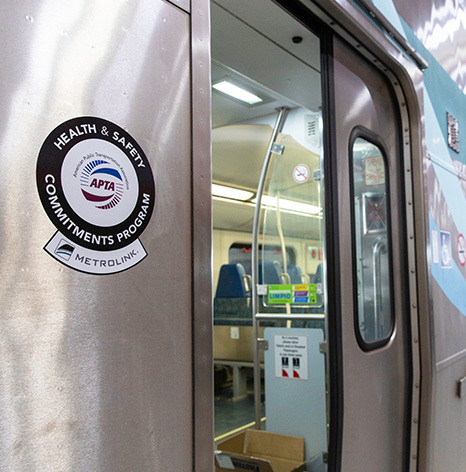 Metrolink train with APTA signage - Health & Safety Commitments Program