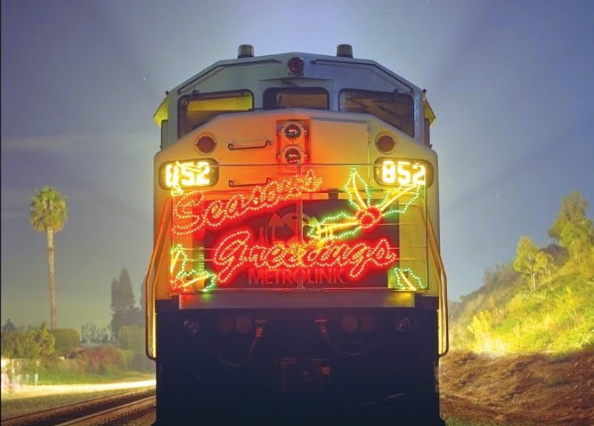 Train front with lights reading 'Seasons Greetings' and holly