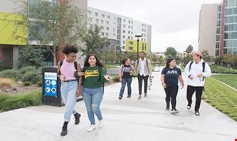 Students walking between Cal Poly Pomona buildings.