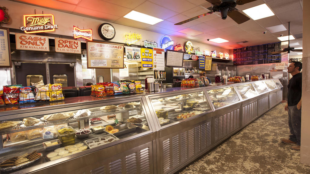 Man ordering at the deli counter at Philippe The Original