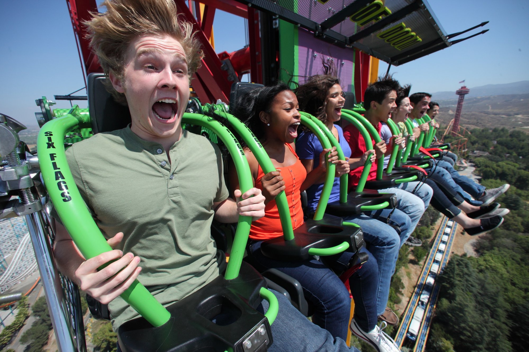 Park visitors screaming on the Lex Luthor Drop at Six Flags Magic Mountain