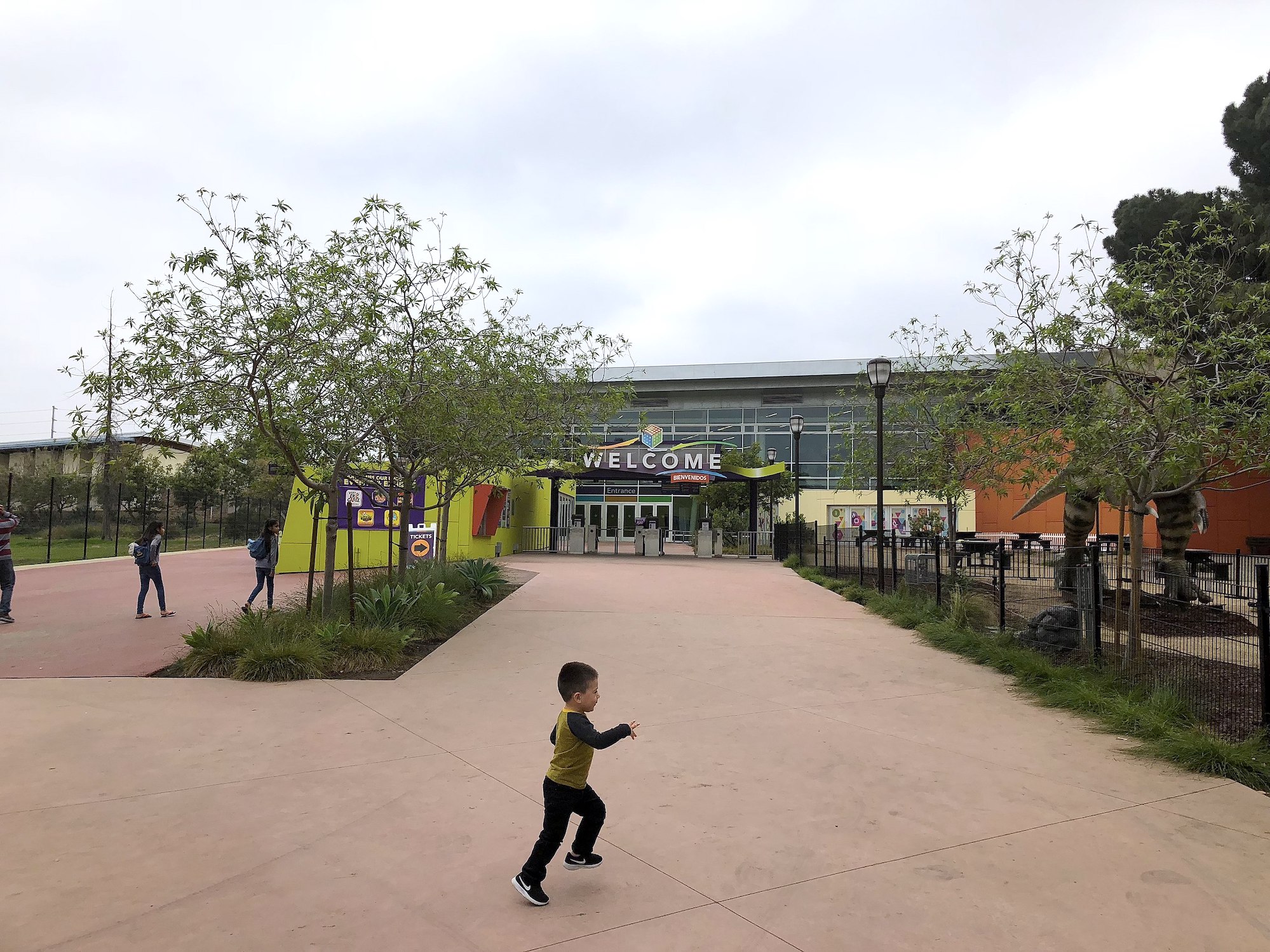 Child running near Discovery cube entrance