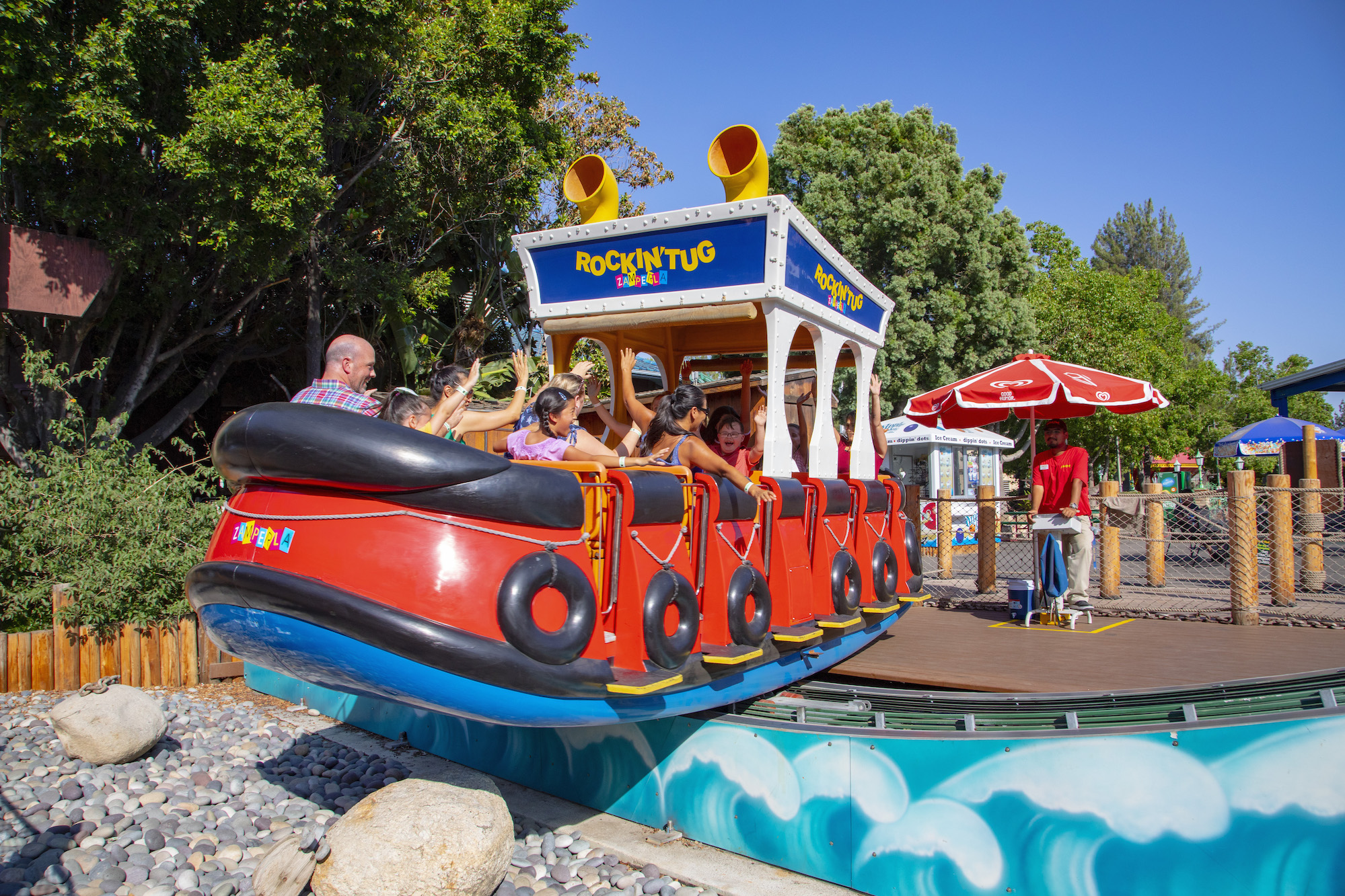 Visitors riding the Rockin Tug at Castle Park