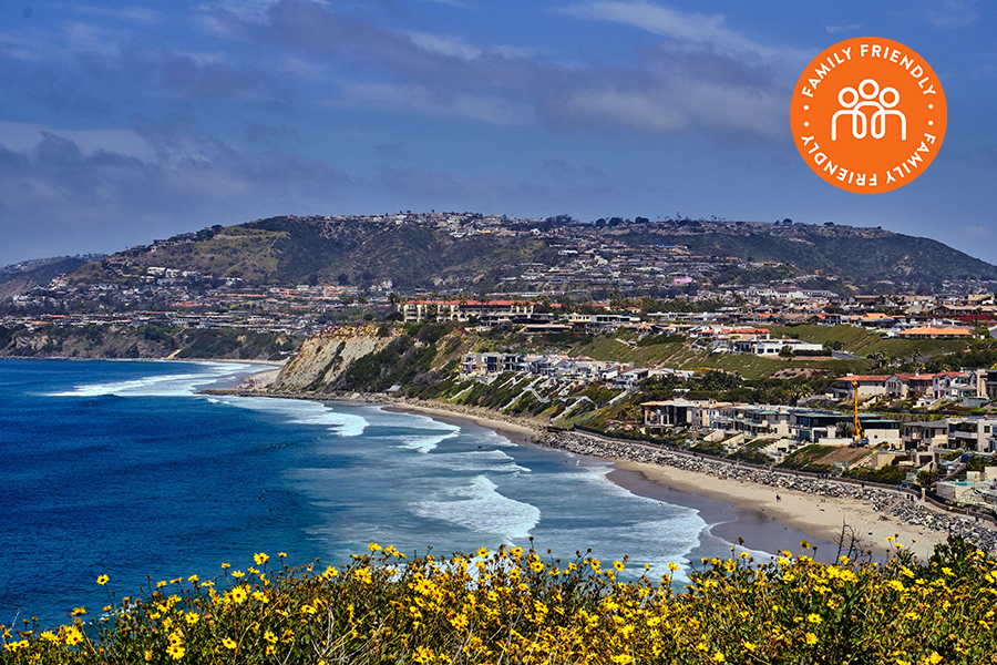 Dana Point beach and cliffs. Image stamped with Family Friendly badge.