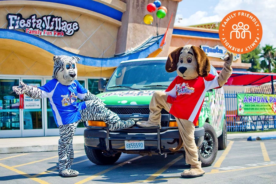 Fiesta Village mascots at the Fiesta Village Family Fun Park.  Image is stamped with family friendly badge.