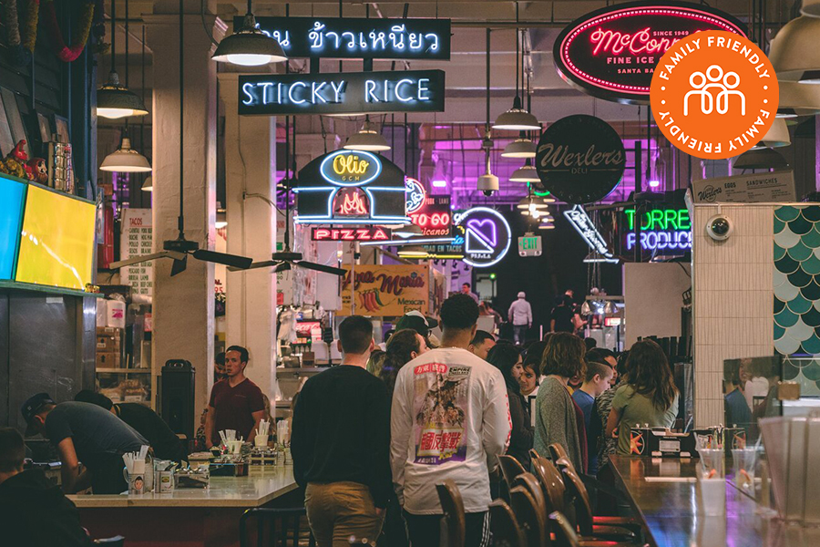 Vendor neon signs inside the Grand Central Market.  Image stamped with Family Friendly badge.