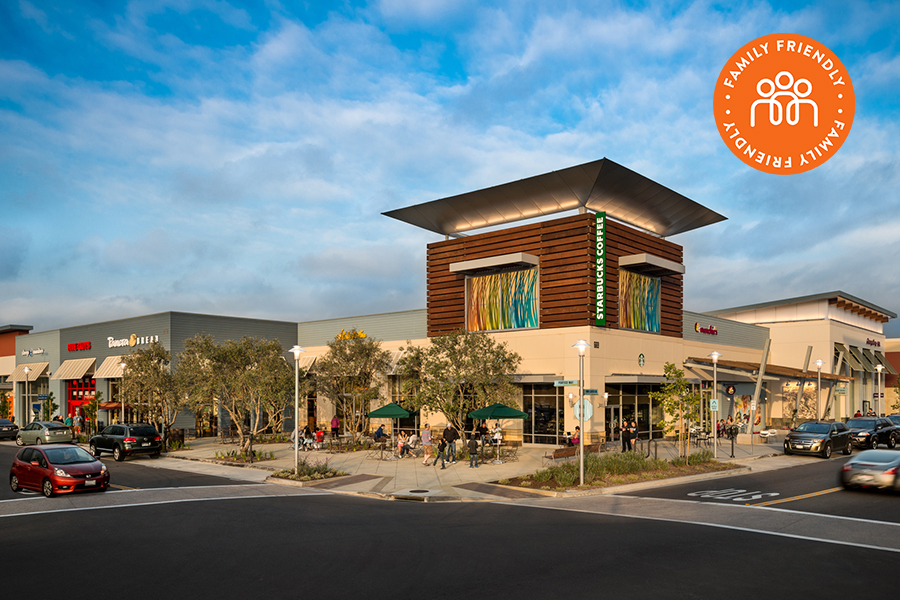 Shops and restaurants at The Collection at RiverPark. Image is stamped with a family friendly badge.