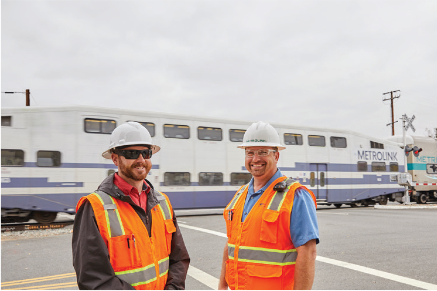 Two Metrolink employees wearing hardhats