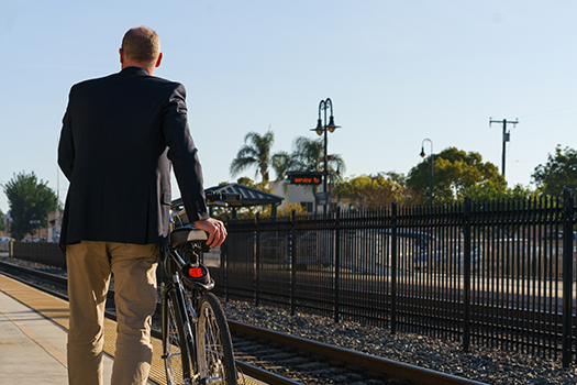 man at the station with a bicycle